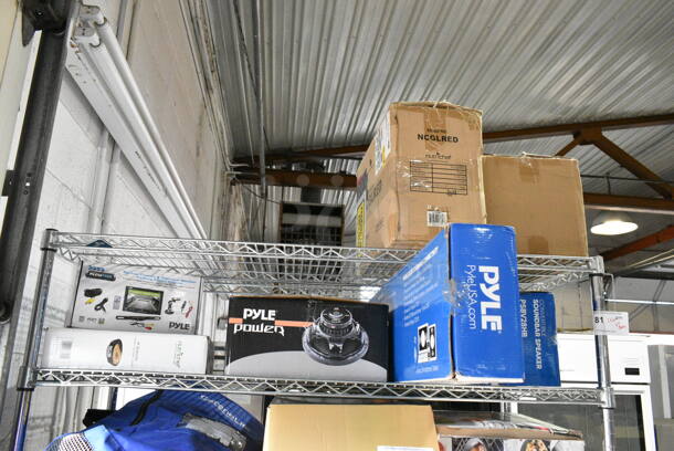 7 Various Items Including SereneLife SLSFE14 Electronic Safe Box, Nutrichef NCGLRED 24-Piece Superior Glass Food Storage Containers Set, PSBV28HB Soundbar Speaker, Pyle Power PLPW12D Subwoofer, PLCM7500 Backup Camera and Rearview Monitor, PCRM12N NutriChef Electric Crepe Maker/Griddle. 7 Times Your Bid!  - Image 1 of 12