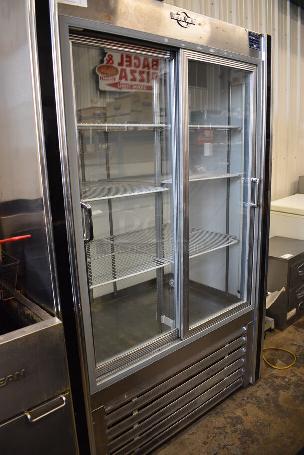 Universal Coolers Stainless Steel Commercial 2 Door Cooler Merchandiser w/ Poly Coated Racks. 48x31x75. Tested and Powers On But Does Not Get Cold