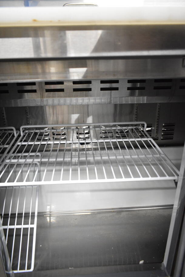 BRAND NEW SCRATCH AND DENT! 2024 Avantco 178APT71HC Stainless Steel Commercial 70" 3 Door Refrigerated Sandwich Prep Table on Commercial Casters. 115 Volts, 1 Phase. Tested and Working!  - Image 7 of 12