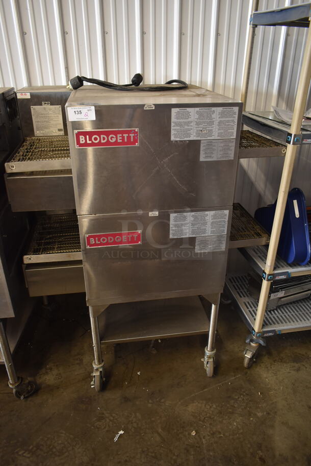 2 Blodgett MT1828G00097 Stainless Steel Commercial Natural Gas Powered Conveyor Pizza Ovens on Equipment Stand w/ Commercial Casters. 38,000 BTU. 2 Times Your Bid!