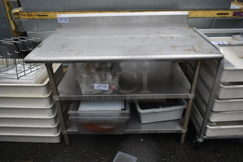 Stainless Steel Commercial Table w/ Back Splash and 2 Under Shelves. Does Not Include Contents.