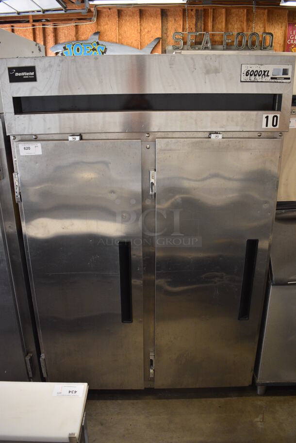 Delfield Model 6151XL-S-BOB-HLL Stainless Steel Commercial 2 Door Reach In Freezer w/ Poly Coated Racks on Commercial Casters. 115 Volts, 1 Phase. 51x32x79. Tested and Working!
