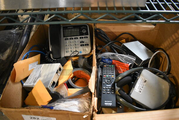 ALL ONE MONEY! Lot of 2 Boxes of Various Items Including Corded Telephones and Dual Sensor Kit! 