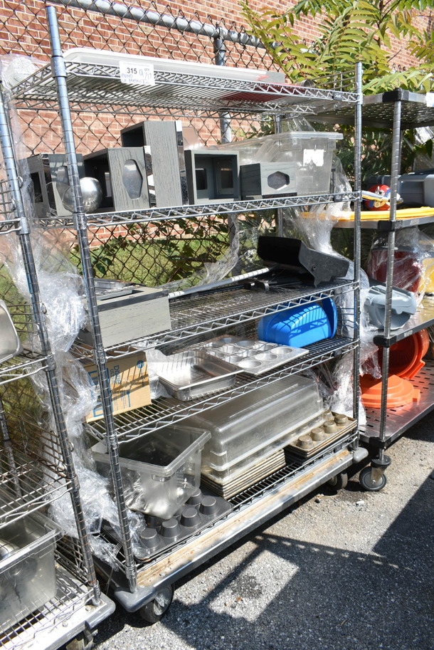 Chrome Finish 5 Tier Wire Shelving Unit w/ Contents Including Muffin Baking Pans, Poly Bins. BUYER MUST DISMANTLE. PCI CANNOT DISMANTLE FOR SHIPPING. PLEASE CONSIDER FREIGHT CHARGES.   - Image 1 of 12