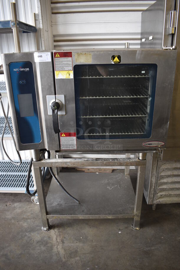 2014 Alto Shaam Model 7.14 ES Stainless Steel Commercial Electric Powered Combitherm Convection Oven w/ View Through Door and Metal Oven Racks on Equipment Stand. 208-240 Volts, 3 Phase. 45x44x61