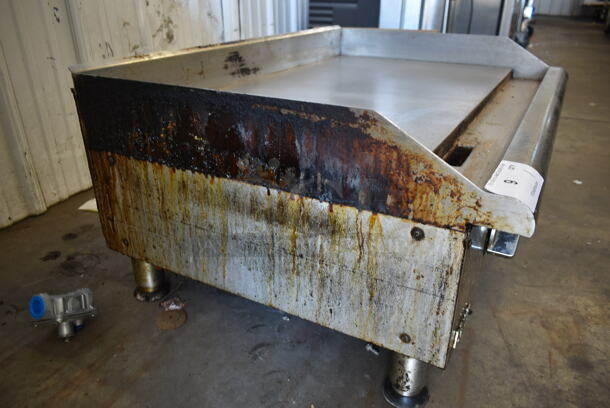 APW Wyott Stainless Steel Commercial Countertop Natural Gas Powered Flat Top Griddle.  - Image 7 of 7