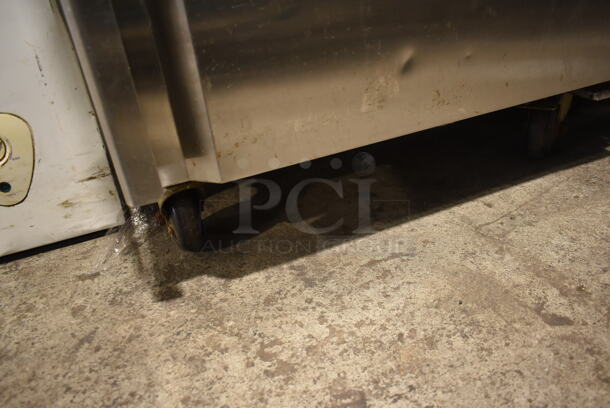 Coldline M28F Stainless Steel Commercial Single Door Reach In Freezer w/ Poly Coated Racks on Commercial Casters. 115 Volts, 1 Phase. Tested and Powers On But Does Not Get Cold - Image 4 of 6