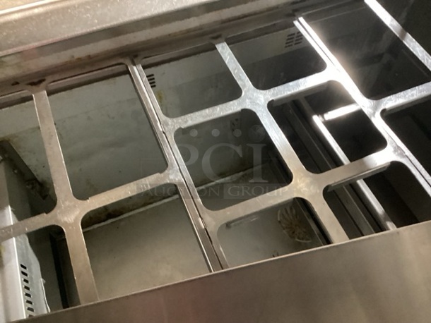 Randell Stainless Steel Dual-Sided Refridgerated Work Island, Multi-Pan Prep Table W/Two -Door and Two Drawers  Refrigerated Storage. Tested And Working. 84 x  46/52 x 58.
 - Image 4 of 11