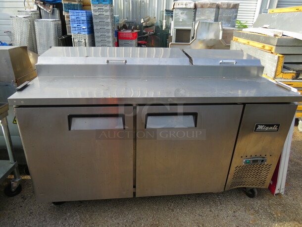One WORKING Stainless Steel Migali 2 Door Refrigerated Prep Table With 2 Racks On Casters. 115 Volt. Model# CPP67. 67X33X44