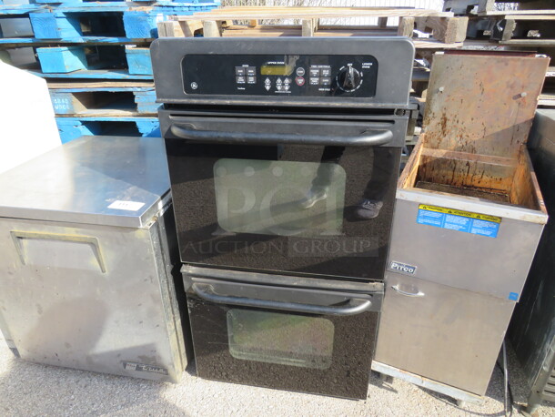 One Black Built In House Hold GE Double Convection Oven. 