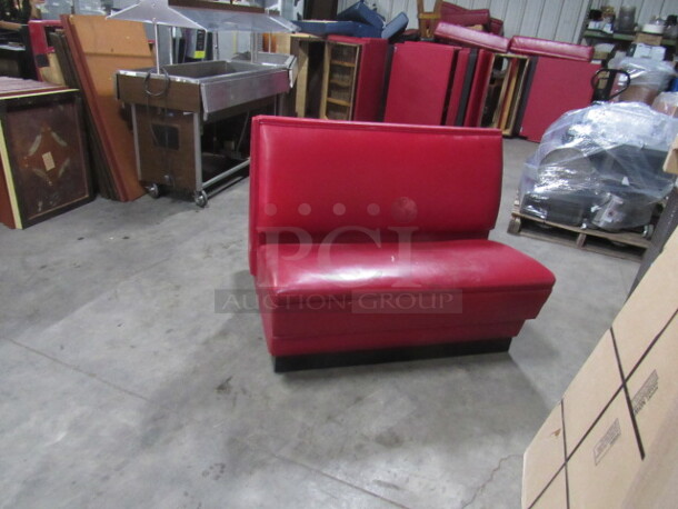 One Single Sided Booth With Red Cushioned Seat And Back. 45X25X36