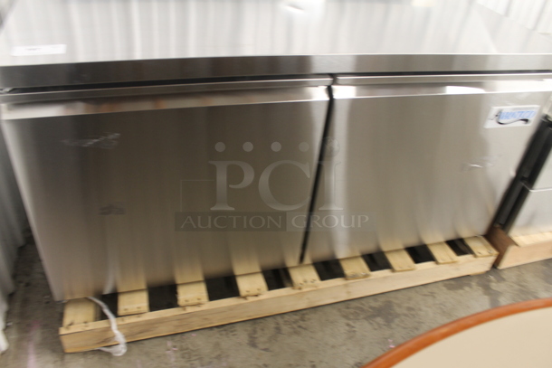 BRAND NEW SCRATCH AND DENT!  Avantco 178SSWT60FHC Commercial Stainless Steel Two Door Worktop Freezer With Backsplash, Polycoated Racks And Commercial Casters. 115V. Tested and Working! - Image 2 of 8
