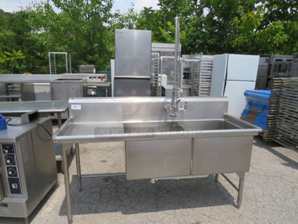 One Stainless Steel 2 Compartment Sink With Left Drain Board, Back Splash And Faucet With Hose Sprayer. 73.5X28.5X42.5. Sink 24X24X15.