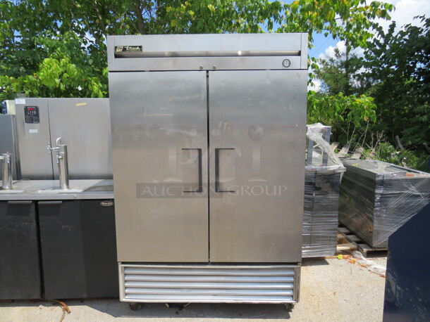 One WORKING Stainless Steel True 2 Door Refrigerator, With 3 Racks, On Casters. 115 Volt. Model# T-49. 54X30X83