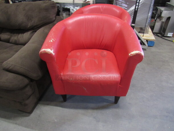 One Red Pleather Cushioned Barrel Back Chair.