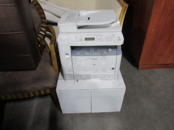 One Cannon Laser Multi Function Print/Copy/Scan/Fax/ Machine On A 2 Door Cabinet. #D1350. 22X21X34