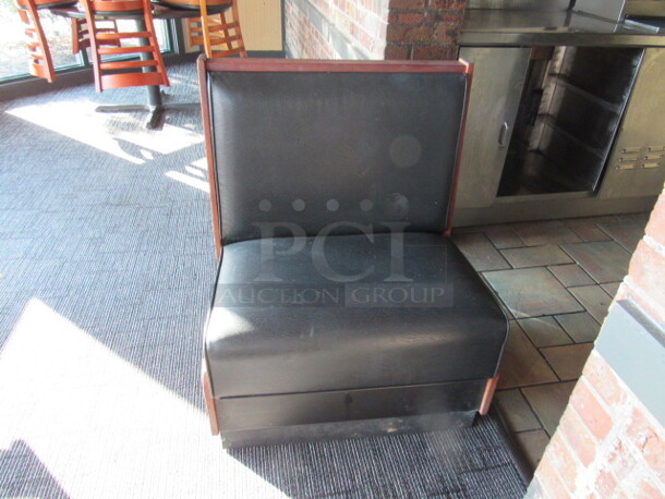 One Single Sided Wooden Booth With A Black Cushioned Seat And Back. 29X24X36
