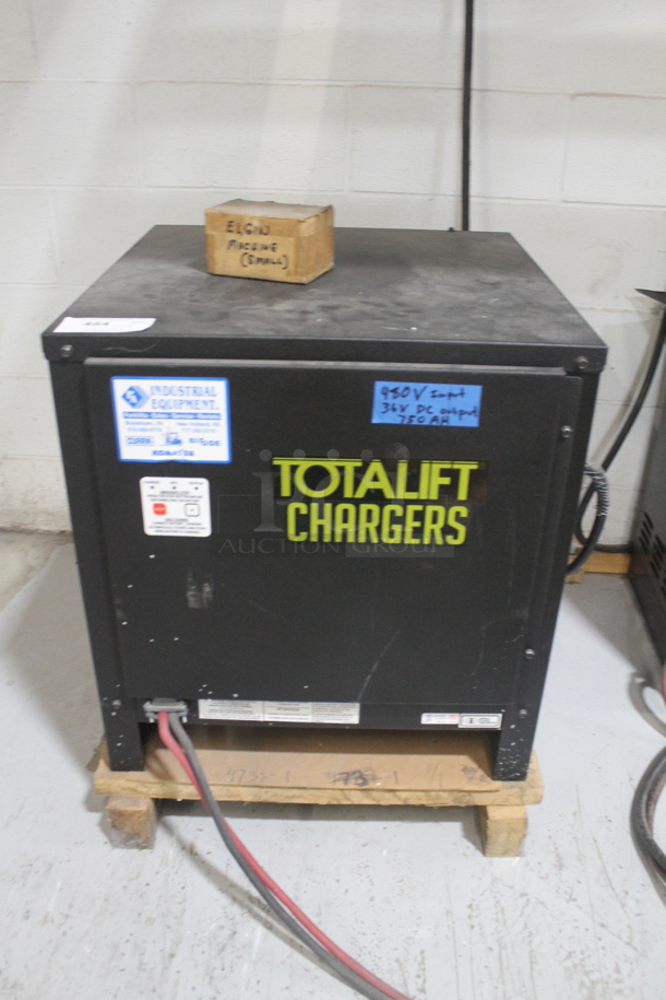 Total Lift Charger Black Metal Charger on Pallet. Goes GREAT w/ Lot 5. BUYER MUST REMOVE: Must Pick Up By Appointment Only Approximately 1 Week After Auction Ends; Will Be Used During Pick Up Day. - Image 1 of 3