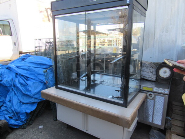 One Glass 2 Door Display Case With Self Closing Doors, On 2 Door Stand With Roll Out Shelves. 42X24X62 - Image 2 of 3