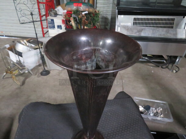 One Metal Vase.