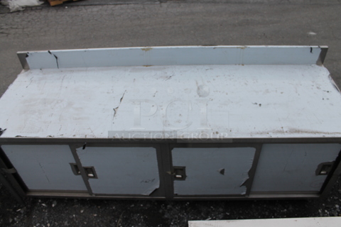 BRAND NEW SCRATCH AND DENT! Stainless Steel Commercial Table w/ Back Splash and 4 Doors.