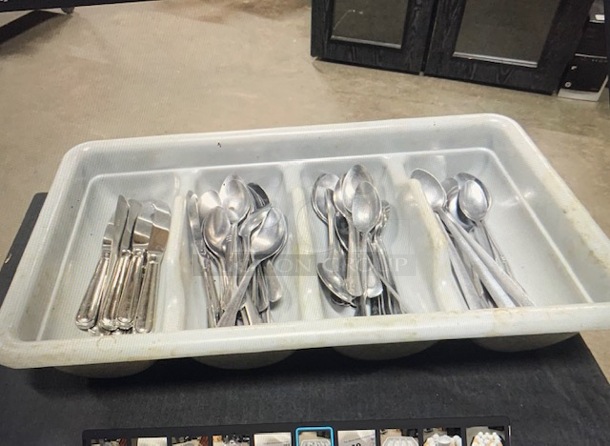One Flatware Holder With Assorted Flatware.