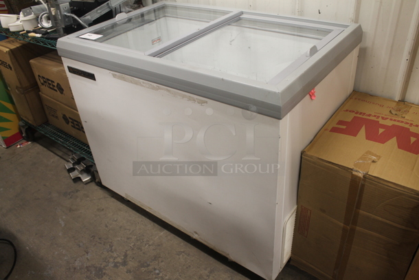 2016 True TFM-41FL Commercial White Horizontal Freezer On Commercial Casters. 115V, 1 Phase. Tested and Does Not Power On