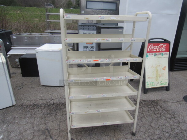 One Metal Shelf With 7 Shelves On Casters. 32X16X58