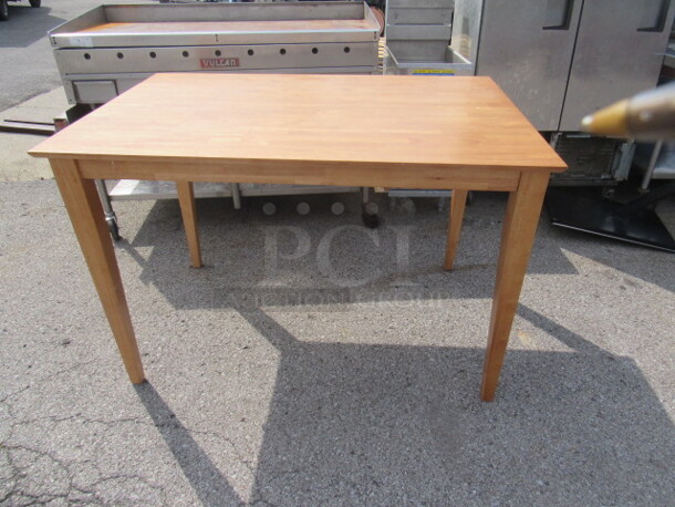 One NEW Wooden Table With Leaf. 54X36X36. With Leaf 54X54X36. Assembly Required. - Image 1 of 6
