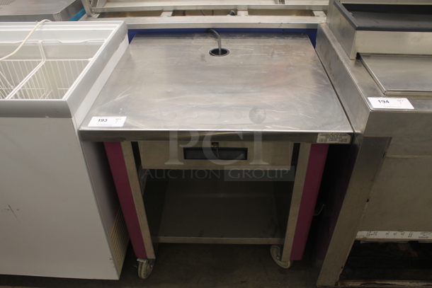 Delfield MARK7 KCS-30-10A Commercial Stainless Steel Electric Cash Register Stand With Key, Open Cabinet, And Pink Detail On Commercial Casters. 115V, 1 Phase. 