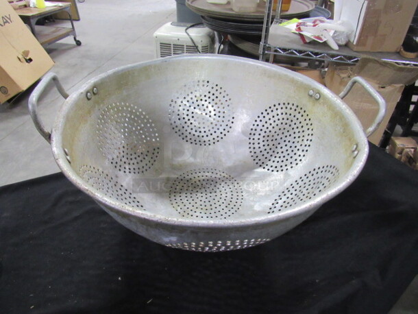 One 16 Inch Aluminum Colander.