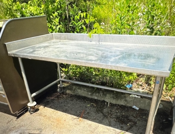One Stainless Steel Table With R/L And Back Splash On Casters. 72X36X40 - Image 1 of 1