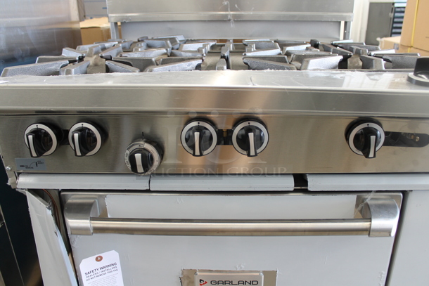 BRAND NEW SCRATCH AND DENT! LATE MODEL! Garland Stainless Steel Commercial Natural Gas Powered 6 Burner Range w/ Convection Oven, Over Shelf and Back Splash.  - Image 3 of 8