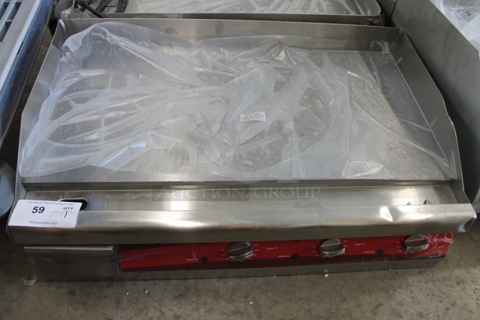 BRAND NEW SCRATCH AND DENT! Avantco 177EG30N Stainless Steel Commercial Countertop Electric Powered Flat Top Griddle w/ Thermostatic Controls. 208/240 Volts, 1 Phase.