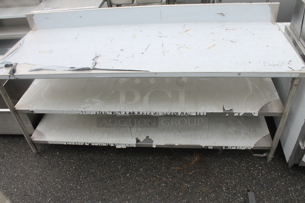 BRAND NEW SCRATCH AND DENT! Stainless Steel Commercial Table w/ 2 Under Shelves and Back Splash. - Image 1 of 4