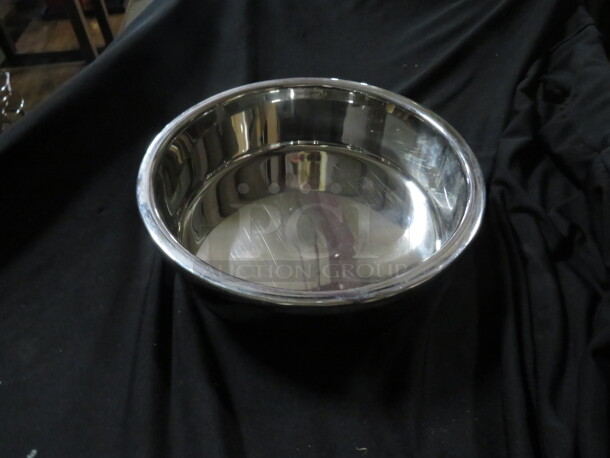 One 19.5 Inch Round Stainless Steel Pan.