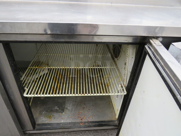 One True 3 Door Prep Table With Over shelf And 2 Ticket Rails, 2 Racks, On Casters. Model# TPP-93. 115 Volt. 93X33X59.5. Not Working - Image 4 of 4