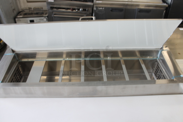 BRAND NEW SCRATCH AND DENT! 2023 Avantco 178SSPPT260 Stainless Steel Commercial Pizza Prep Table on Commercial Casters. 115 Volts, 1 Phase. Tested and Does Not Power On - Image 5 of 9