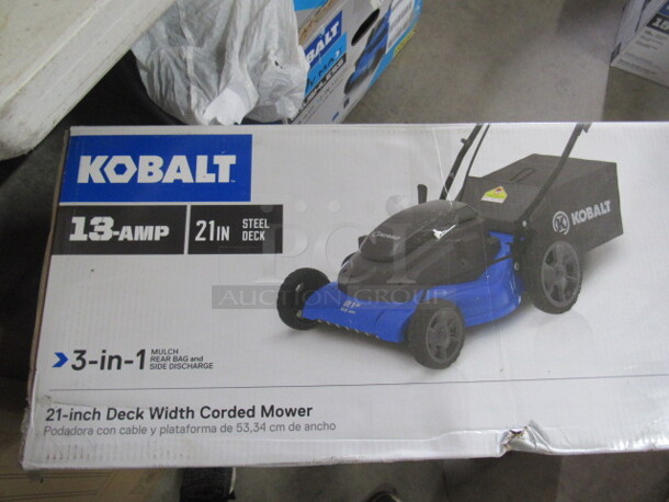 One Kobalt 21 Inch Corded Mower With Mulcher, Rear Bagger, With Side Discharge.
