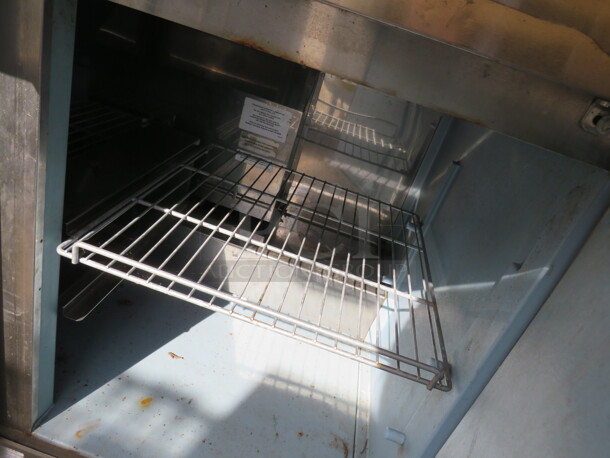 One Delfield 2 Door Refrigerated Prep Table With 2 Racks, And Cutting Board, On Casters. Model# 4448N-18M. 115 Volt. 48X40X46 - Image 2 of 3