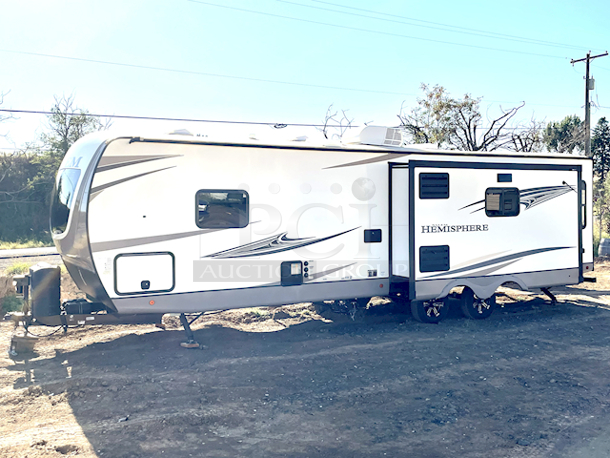 ? 2021 Forest River Salem Hemisphere 271RL-W 34ft 7in Travel Trailer With Upgraded Options Package & VIP Package. ? Includes All Original Paper Work. In LIKE NEW CONDITION minus a scratched piece of flooring on the kitchen side by the push out (see Photos).

MORE PHOTOS ON NUMBER 420 - Video on our Facebook Page: PCI Auctions West Coast
TRAVEL TRAILERS STANDARD FEATURES
• Extra Large Pass Thru Storage
• Versa Queen in Bunk Slides Standard
• European Oak colored horizontal plank linoleum Flooring
• Outside Kitchen Standard (270FKS, 273RL, 310BHI, 314BUD)
• Saddle colored wood cabinetry w/ matte black hardware
• Side-Mounted Heat Ducts
• Pantry Doors w/ Glass Inserts & Motion Sensor Pantry Lights
• Stackable Washer/Dryer Prep Std. on 270FKS, 308RL, 310BHI
• 7-Way “Rain Defense” Plug Holder (Front Frame)
• Wide Stance Axle System
• 2-Tone Painted Fiberglass Front Cap with Automotive Windshield
(N/A Windshield 308RL)
• Hidden Hinges on Cabinet Doors
• 50 Amp Service Standard
• 10 CU FT Black Refrigerator (12V)
• Laminated “Aluma Frame” Sidewalls and Floor with Block
Foam Insulation
• Heated & Enclosed Underbelly
• Radial Tires with Black-Accented Aluminum Rims
• Interior Grab Handle at Entry Door
• Shaded Pet Tether/Security Hook
• LED-Lit Theater Seating with Recliners (Most Models) • Designer’s Choice Luxury Comforter
• Exterior Bottle Opener

UPGRADED OPTIONS PACKAGE (INCLUDED)
• High Rise Faucet with Pull-Out Sprayer
• Spare Tire & Carrier
• Outside Shower
• 15,000 BTU A/C Ducted with Quick Cool
• Ivory Performance Colored Exterior Fibererglass with
Smoked Quartz Metallic Accents • Central Switch Center
• Solar Prep
• Lippert “On The Go” Ladder Prep • LP Quick Connect
• Extra Wide 30” Entrance Door
• Tri-Fold Sleeper Sofa or Theater Sofa

VIP PACKAGE (INCLUDED)
• Extra Large Max-Tint Panoramic Window Package
• 12V Heat Pads on All Holding Tanks
• Recessed Glass Stove Top Cover
• Midnight Glass Range Hood
• Midnight Glass Microwave
• Back Up Camera Prep
• Step Above Aluminum Entry Steps (Main Entry Door)
• 50” LED TV & Furrion Soundbar with FM, Bluetooth, HDMI, & USB • Stainless Steel, Single Bowl Undermount Sink with Roll Up
Sink Cover
• Power Stabilizer and Tongue Jacks
• Friction Door Hinge
• Baggage Door Magnets and Easy Pull Slam Latches
• LED Awning, Front Cap, Marker and Tail Lights
• 31” Glass Mirror Front Electric Fireplace
• Porcelain Toilet - Image 4 of 12