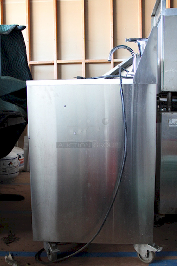 AMAZING! Crown Verity CV-PHS-4C Space Saver Single Bowl Cold Water Portable Hand Sink Cart. Includes: Electric Pump (120V), Hands Free Pump Saver Foot Pedal, Power Outlet, Soap Dispenser Holder and Paper Towel Dispenser. Allows For Hook-Up To City Water. On Commercial Casters. Keys Not Included. 25x24-1/4x47-3/4 

Condition is 9/10 - Lighting Makes It Difficult To Photograph - Image 10 of 12