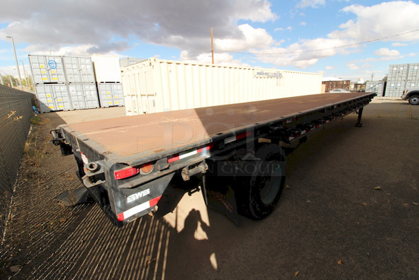 ROAD READY!! 40FT Steel Flatbed Tailer, 4 Wheels. 40FTx96".    VIN# 070F1283; Year 1970; Manufacturer Pike Trailer; Type Flatbed; Steel Construction; Length x Width 40' x 96"; Spring Ride Suspension; Location Single Fixed Axle; Tire Size LP 22.5; Wheel Construction Steel; Wheel Type Budd - Image 6 of 10