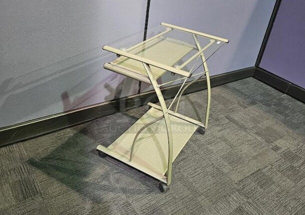 Metal silver rolling small desk with glass top. In good condition! Minor wear and scratches but cleans up very nicely and is fully functional. 27” W x 29” H x 19” D.  - Image 2 of 3