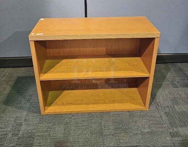 Wooden end table and bookshelf set- 1 of each piece. End table shows some minor scuffs on the legs but in sound condition. Bookcase is in great used condition. Perfect additions to home, business or office. End table measures 20” H x 24” W. Bookcase measures 30” H x 36” W.   - Image 2 of 3