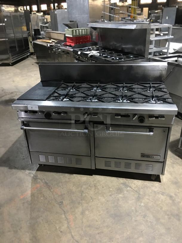 AN ANMAZING FIND! Garland 8 Burner Stove! With Left Side Hot Plate! With Back Splash! With 2 Full Size Ovens Underneath! With Metal Oven Racks! All Stainless Steel! On Casters!