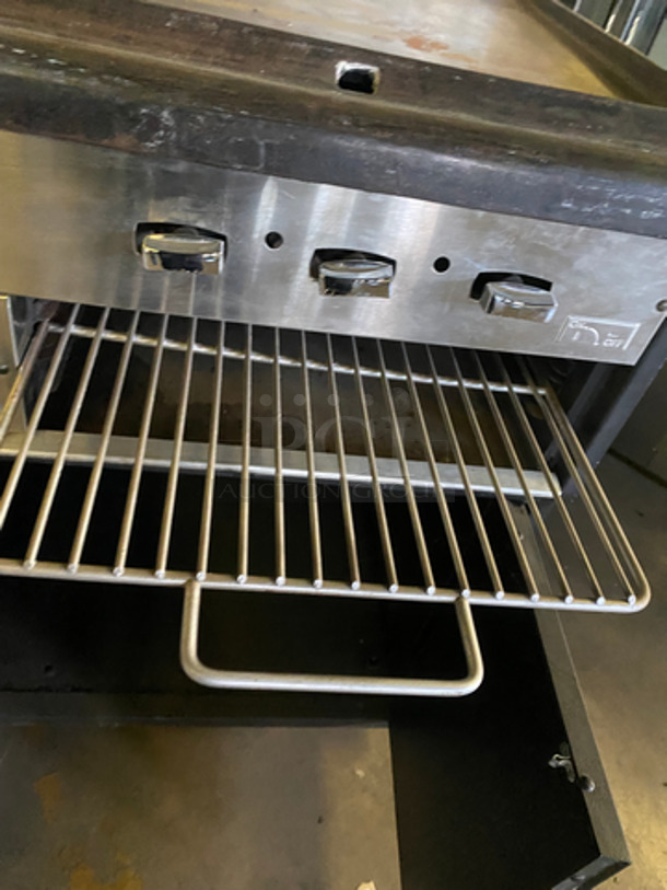 Commercial Natural Gas Powered 4 Burner Stove! With Built In Flat Top Grill! With Back Splash And Salamander Shelf! With Full Size Oven! Metal Oven Rack! With 2 Door Storage Area Underneath! All Stainless Steel! - Image 11 of 12