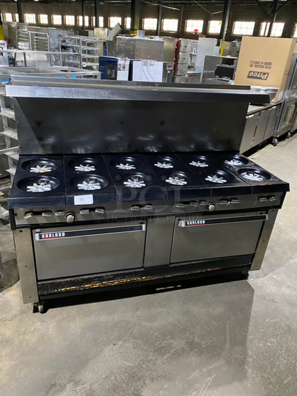 AMAZING FIND! Garland Natural Gas Powered 12 Burner Stove! With 2 Full-Sized Ovens! With Metal Oven Racks! With Raised Back Splash & Salamander Shelf! Stainless Steel! On Casters!
