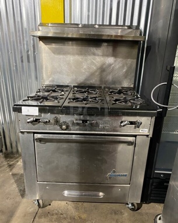 Garland Commercial Natural Gas Powered 6 Burner Stove! With Raised Back Splash And Salamander Shelf! With Oven Underneath! All Stainless Steel! On Casters! WORKING WHEN REMOVED!