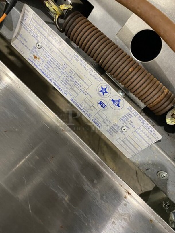 Garland Commercial Natural Gas Powered 4 Burner Stove! With Back Splash! With Oven Underneath! Metal Oven Rack! All Stainless Steel! On Casters! Model: M44R SN: 1601100100589 - Image 9 of 10